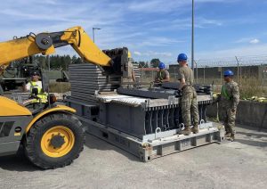 Soldiers from the 1st Inland Cargo Transfer Company, 39th Transportation Battalion, unload a pallet carrying the Rapidly Available Interface for trans-Loading, or RAIL, modular ramp system. This is the first operational implementation of the RAIL system in Europe. It’s being used to support the 405th Army Field Support Brigade with its mission to return over 5,000 Army Prepositioned Stocks-2 vehicles and equipment pieces to its APS-2 worksite in Mannheim, Germany. (Courtesy photo)