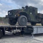 A Joint Light Tactical Vehicle is uploaded onto a transport truck using the new Rapidly Available Interface for trans-Loading, or RAIL, modular ramp system. To help expedite the movement of more than 5,000 Army Prepositioned Stocks-2 vehicles and equipment pieces, the 405th Army Field Support Brigade teamed up with movement control and transportation experts from the 1st Inland Cargo Transfer Company, 39th Transportation Battalion, and are using the new RAIL system. (Courtesy photo)